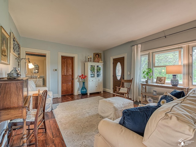 6603 S Stony Creek Rd, Monroe, MI 48162 - living area with baseboards and dark wood-type flooring