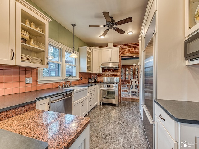 6603 S Stony Creek Rd, Monroe, MI 48162 - kitchen featuring ceiling fan, granite finish floor, dark countertops, and stainless steel appliances