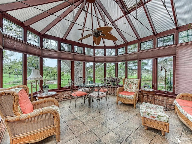 6603 S Stony Creek Rd, Monroe, MI 48162 - sunroom / solarium featuring stone tile floors, high vaulted ceiling, plenty of natural light, and beam ceiling