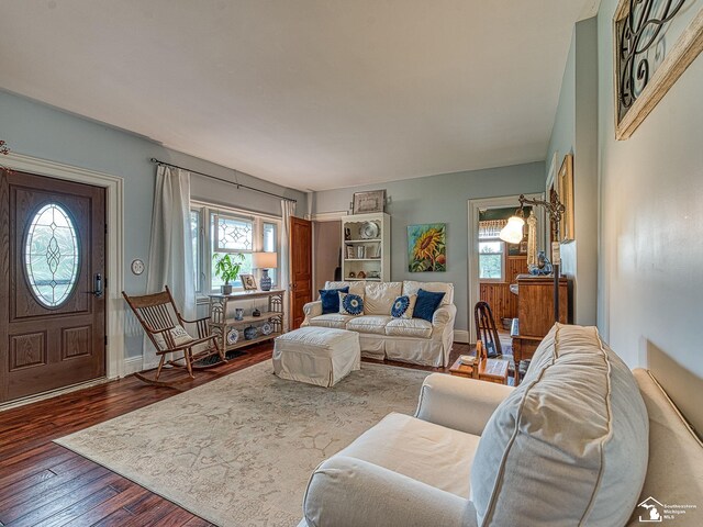 6603 S Stony Creek Rd, Monroe, MI 48162 - living room featuring baseboards and wood finished floors