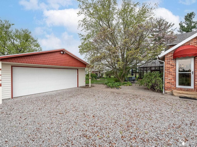 6603 S Stony Creek Rd, Monroe, MI 48162 - garage with gravel driveway