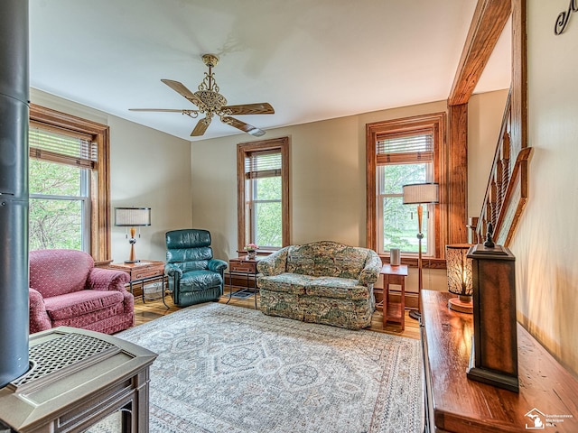 6603 S Stony Creek Rd, Monroe, MI 48162 - living area with a healthy amount of sunlight, stairway, a ceiling fan, and wood finished floors