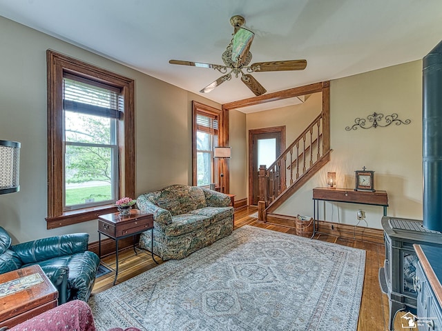 6603 S Stony Creek Rd, Monroe, MI 48162 - living area with a ceiling fan, stairs, and wood finished floors