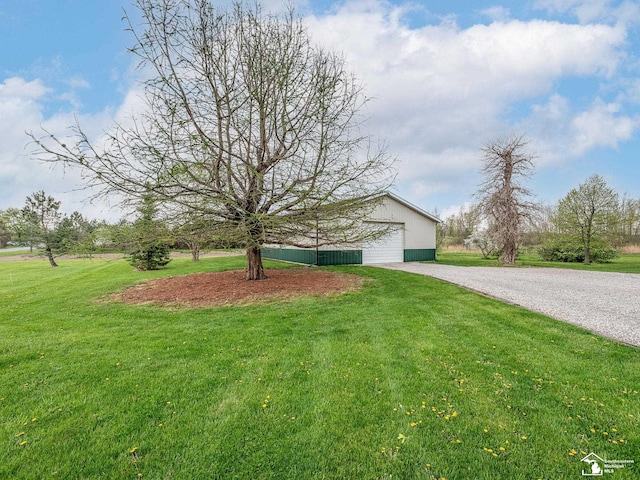6603 S Stony Creek Rd, Monroe, MI 48162 - exterior space featuring a yard, gravel driveway, an outbuilding, and a garage