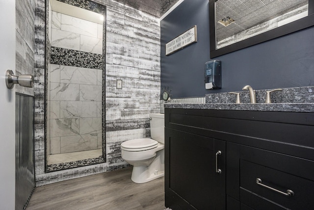 2134 Sycamore Ln, Kalamazoo, MI 49008 - bathroom with toilet, walk in shower, wood finished floors, and vanity