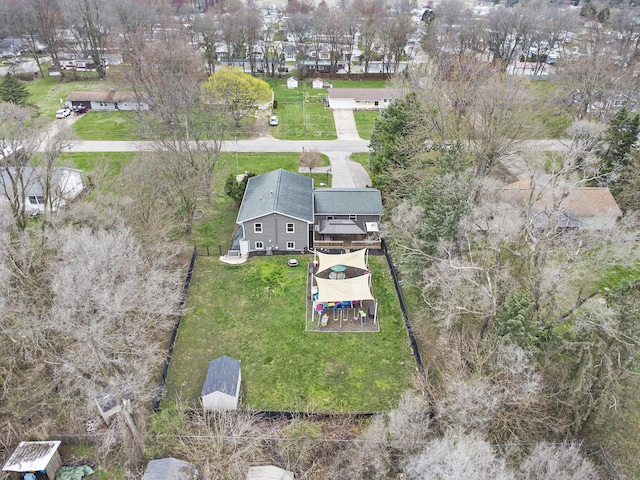 birds eye view of property with a residential view