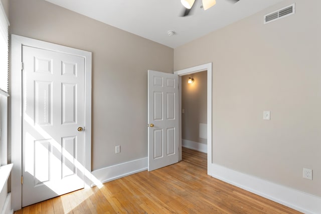 109 Leicester Ct, Detroit, MI 48202 - unfurnished bedroom with light wood-style flooring, baseboards, and ceiling fan