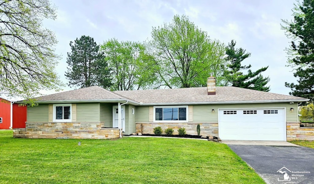 ranch-style house with a chimney, a garage, aphalt driveway, and stone siding