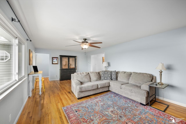485 W Samaria Rd, Temperance, MI 48182 - living room with baseboards, ceiling fan, and light wood-type flooring