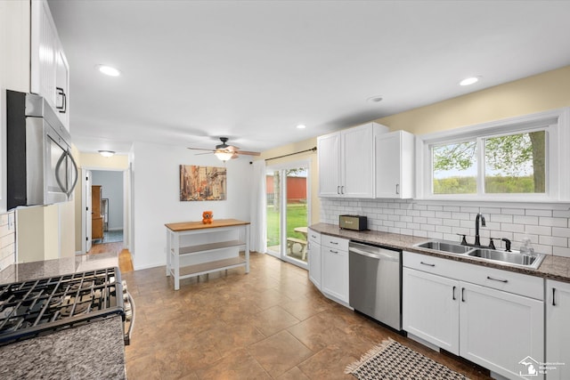 485 W Samaria Rd, Temperance, MI 48182 - kitchen featuring backsplash, appliances with stainless steel finishes, a wealth of natural light, and a sink