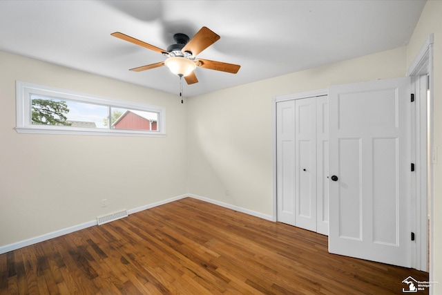 485 W Samaria Rd, Temperance, MI 48182 - unfurnished bedroom with baseboards, a closet, wood finished floors, and visible vents