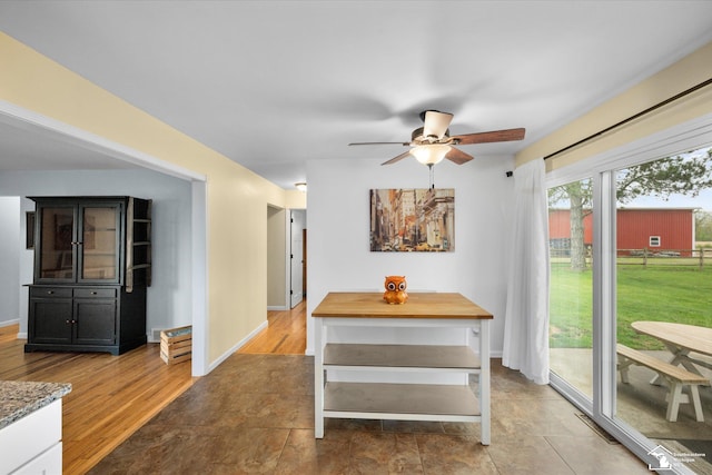 485 W Samaria Rd, Temperance, MI 48182 - dining room featuring baseboards, light wood-style flooring, and ceiling fan