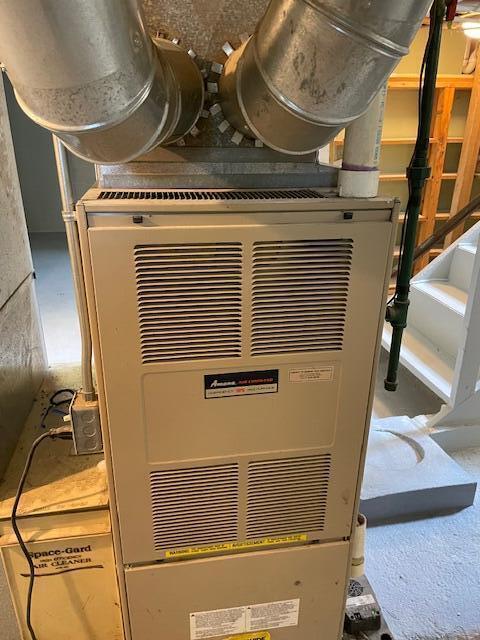 utility room with heating unit