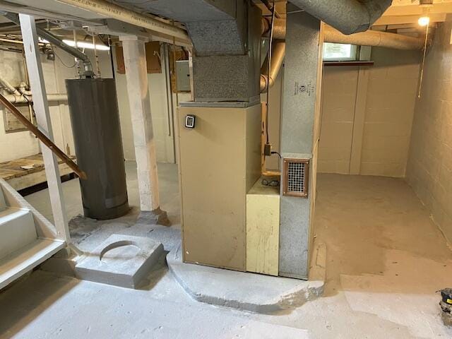 unfinished below grade area with heating unit, water heater, and electric panel