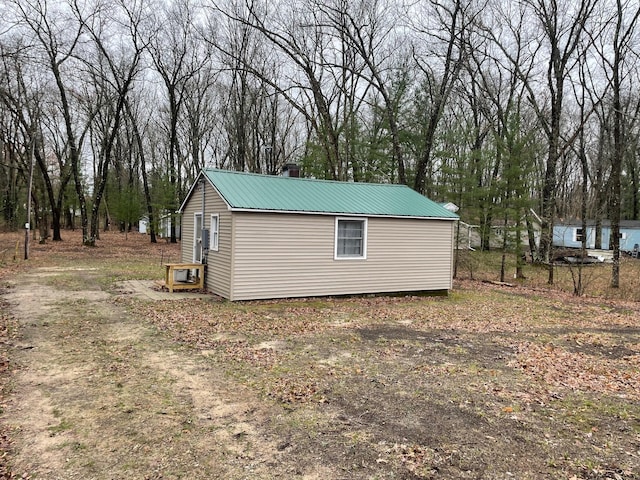 17127 Cheyne Dr, Wellston, MI 49689 - view of outdoor structure featuring view of wooded area