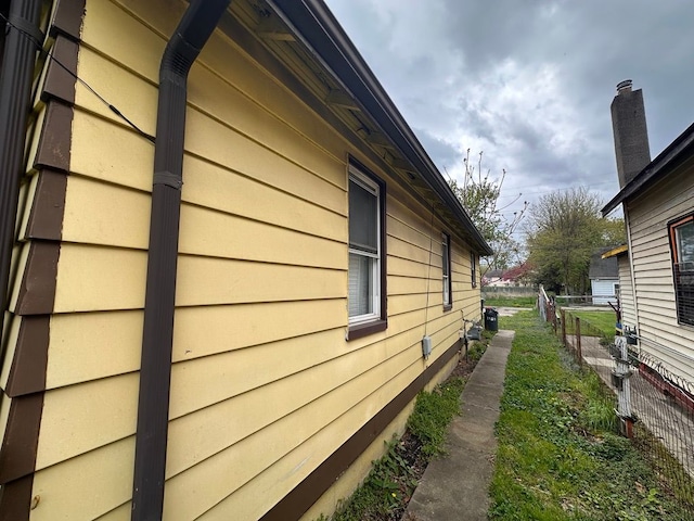 view of property exterior featuring fence