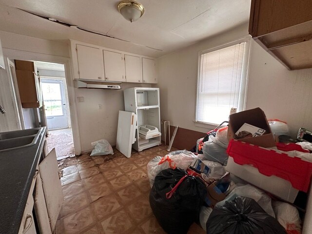 kitchen with a sink and white cabinets