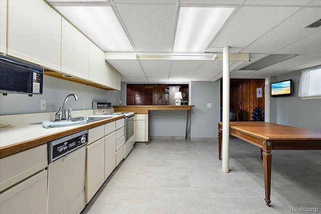 62 Robertson Ct, Clarkston, MI 48346 - kitchen with white appliances, a paneled ceiling, a sink, white cabinets, and light countertops