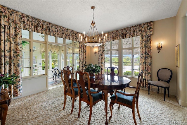 62 Robertson Ct, Clarkston, MI 48346 - carpeted dining space featuring plenty of natural light, a chandelier, baseboards, and a textured ceiling