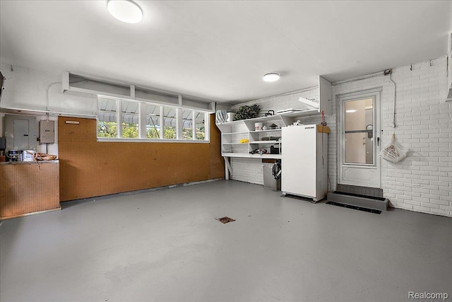 62 Robertson Ct, Clarkston, MI 48346 - garage with freestanding refrigerator