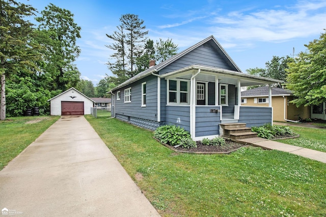 187 S Saginaw St, Montrose, MI 48457 - view of front of house featuring a porch, concrete driveway, an outbuilding, and a front lawn