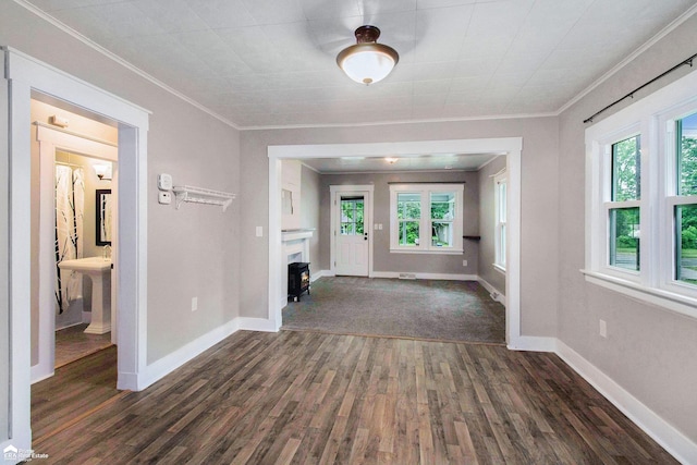 187 S Saginaw St, Montrose, MI 48457 - interior space with dark wood finished floors, plenty of natural light, and ornamental molding