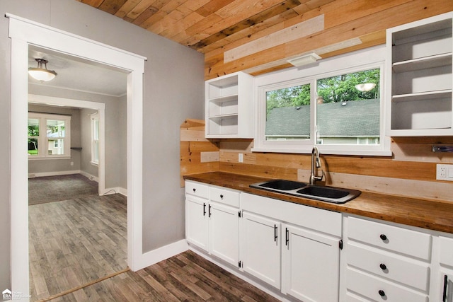 187 S Saginaw St, Montrose, MI 48457 - kitchen featuring open shelves, wood ceiling, wood counters, dark wood-style floors, and white cabinetry