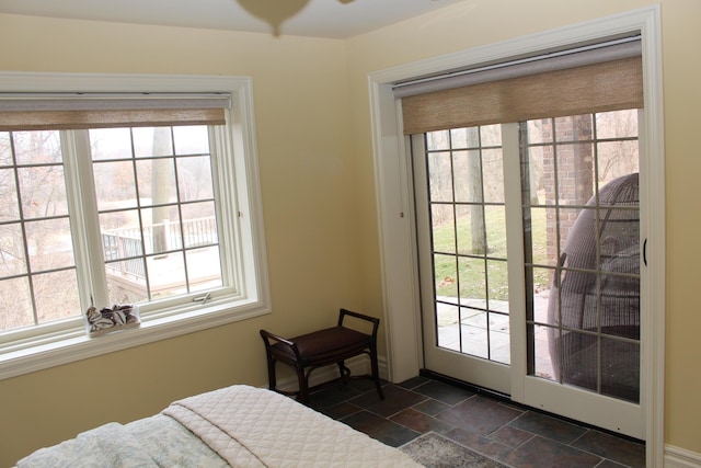 bedroom featuring stone tile flooring