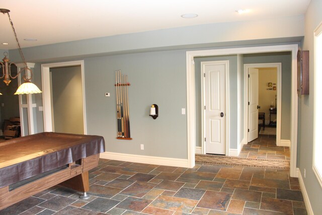 rec room featuring stone tile flooring, billiards, and baseboards