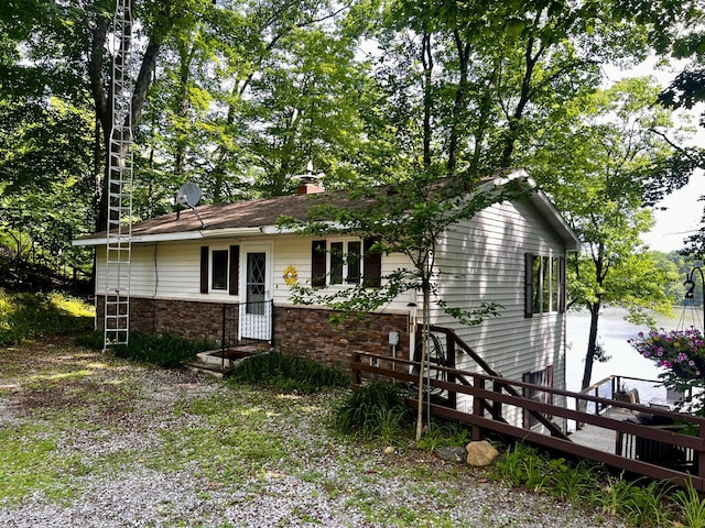 6302 E Interlochen Rd, Fountain, MI 49410 - single story home with a chimney
