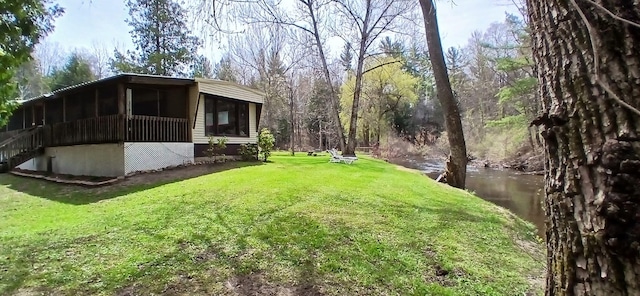view of yard with a sunroom