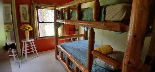 bedroom featuring carpet and multiple windows