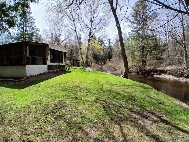 view of yard featuring a sunroom