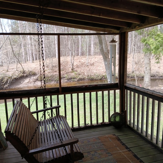wooden terrace with a yard