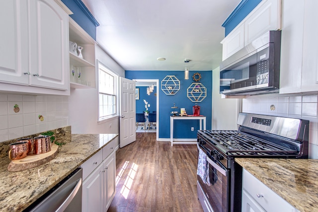 kitchen featuring appliances with stainless steel finishes, open shelves, tasteful backsplash, white cabinets, and dark wood finished floors