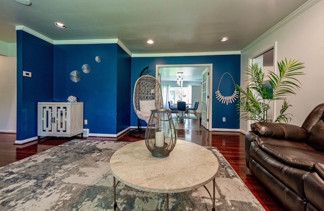 living area with wood finished floors, baseboards, recessed lighting, and ornamental molding