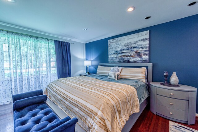 bedroom with wood finished floors and recessed lighting
