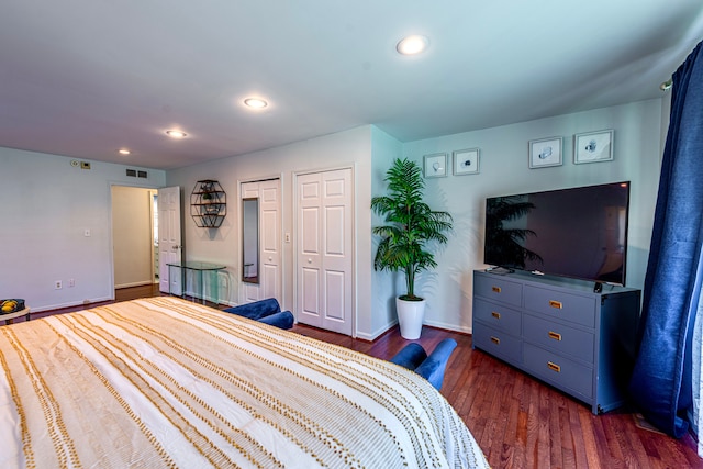 bedroom with dark wood-style flooring, baseboards, and recessed lighting