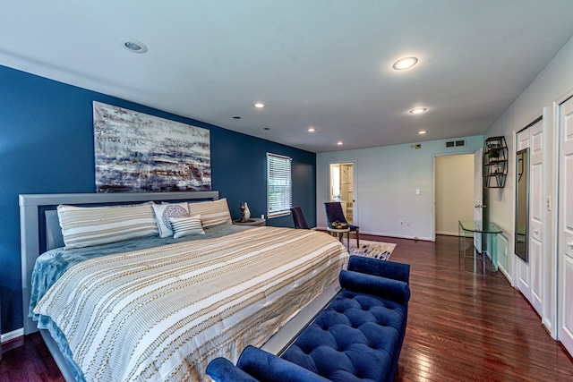 bedroom with wood finished floors, recessed lighting, and baseboards