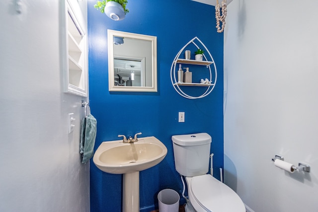 bathroom featuring toilet and a sink