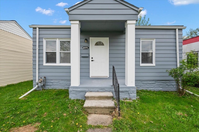 20040 E 8 Mile Rd, Harper Woods, MI 48225 - view of front of home with a front lawn