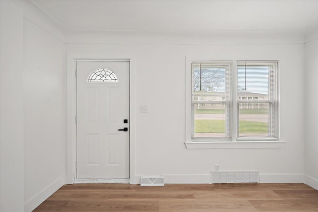 20040 E 8 Mile Rd, Harper Woods, MI 48225 - foyer entrance featuring wood finished floors and baseboards
