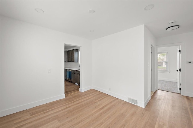 20040 E 8 Mile Rd, Harper Woods, MI 48225 - unfurnished room featuring light wood-type flooring and baseboards