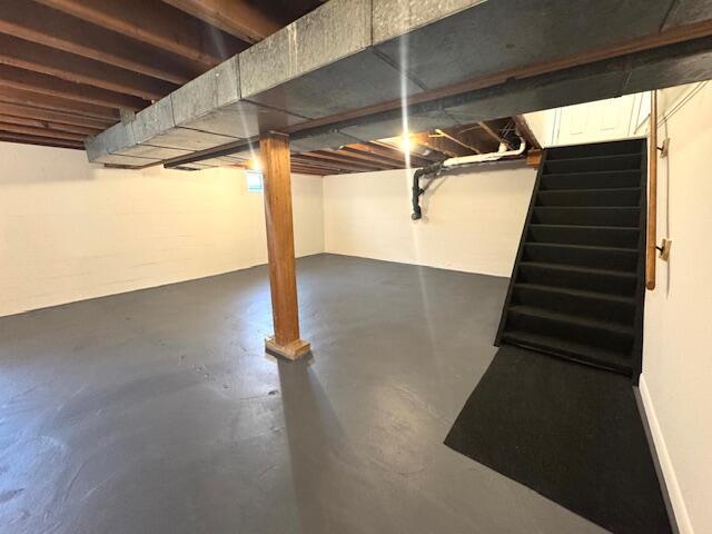 basement featuring stairs