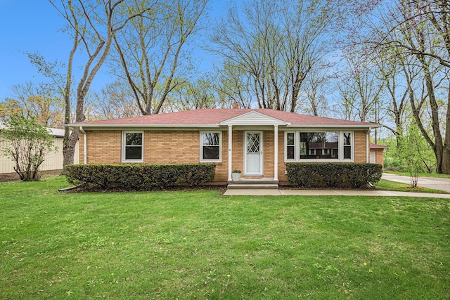 4031 Royal Curv, Saint Joseph, MI 49085 - single story home with a chimney, brick siding, and a front yard