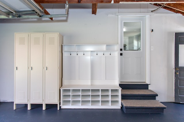 mudroom with finished concrete floors