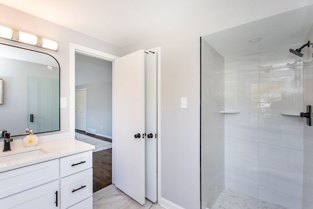 bathroom featuring vanity, marble finish floor, a stall shower, and visible vents
