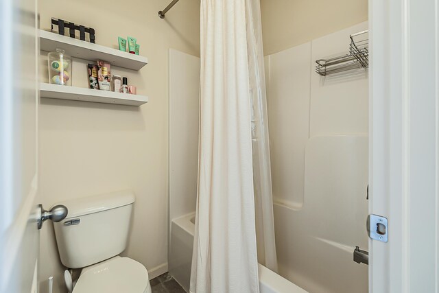 full bathroom with toilet and shower / tub combo with curtain