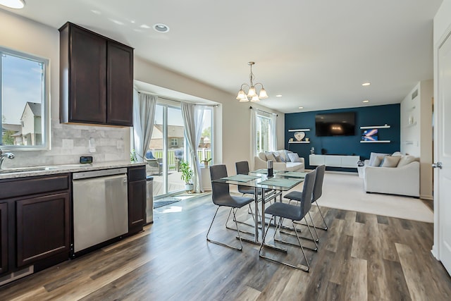 dining area featuring an inviting chandelier, recessed lighting, and dark wood-style flooring