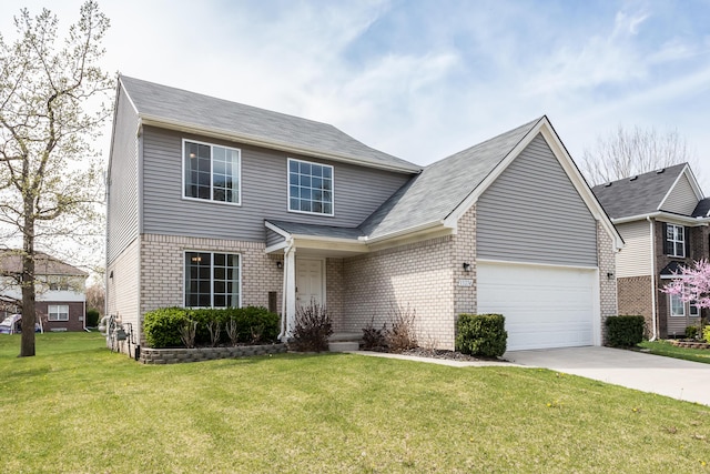view of front of home with an attached garage, concrete driveway, a front yard, and brick siding